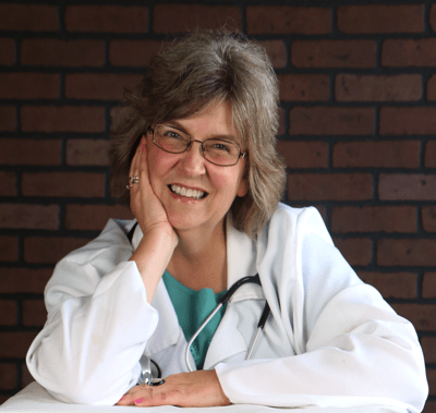 Cathy Allen in doctor coat with stethoscope